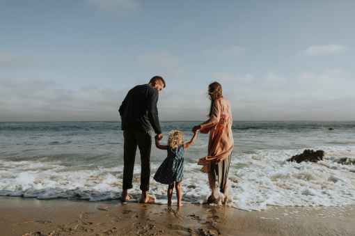 photo of family on seashore